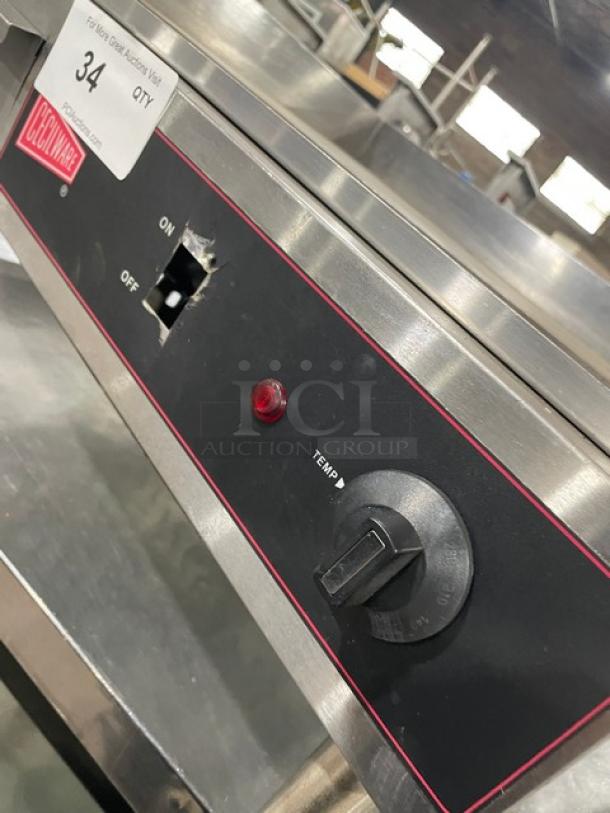 Cecilware electric griddle model EL1624 with thermostatic control. Features stainless steel, 24" flat surface, back, and side splash.
