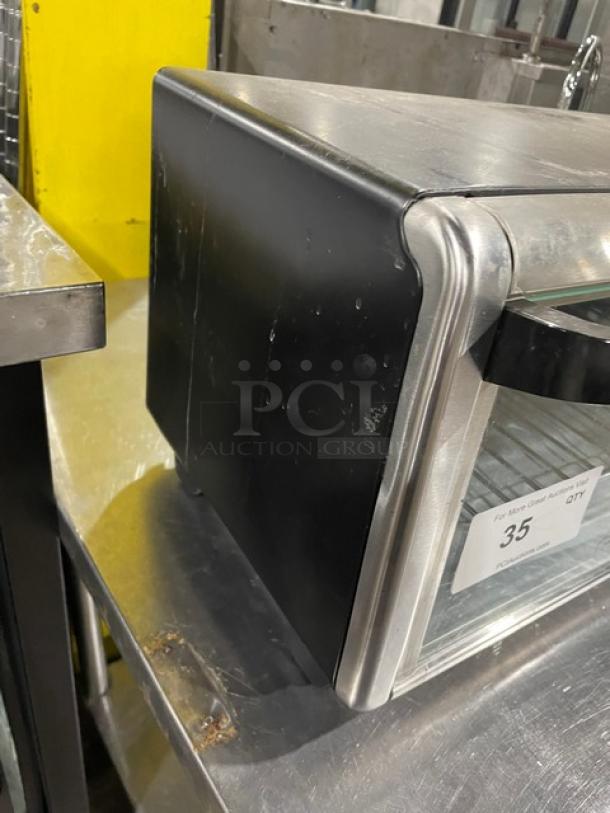 BLACK+DECKER TO3250XSB convection toaster oven, stainless steel, extra wide, on legs, model visible; commercial-grade.