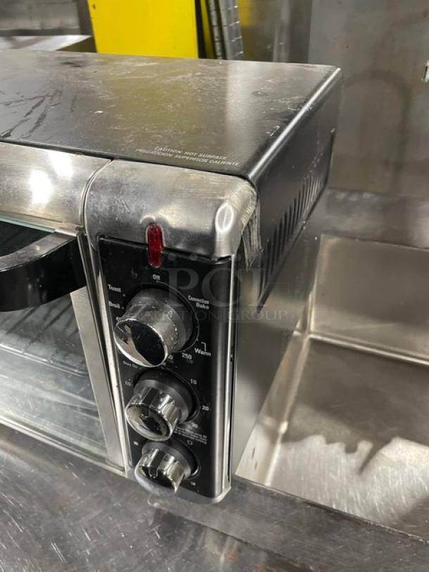 BLACK+DECKER TO3250XSB convection toaster oven, stainless steel, extra wide, electric, 120V, on legs, visible controls.