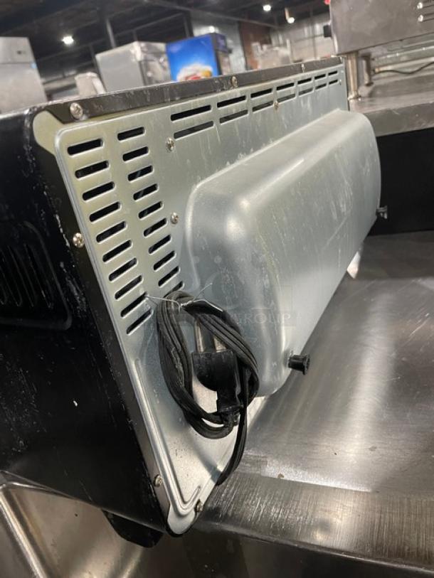 BLACK+DECKER TO3250XSB stainless steel convection toaster oven, 120V, with power cord, on legs, moderate wear.