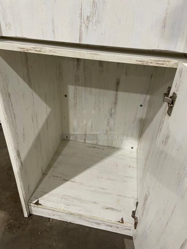 Commercial wooden enclosed-style trash cabinet, rustic finish, single hinged door, visible wear, suitable for waste receptacle.