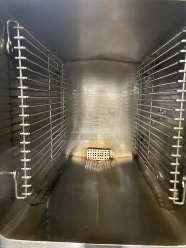 Cleveland Range SteamCraft Power-10 dual compartment 10-pan stainless steel convection steamer interior with pan rack.