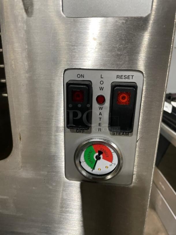 Cleveland Range SteamCraft 24CGP10 controls with on/off buttons, low water indicator, and pressure gauge. Stainless steel.