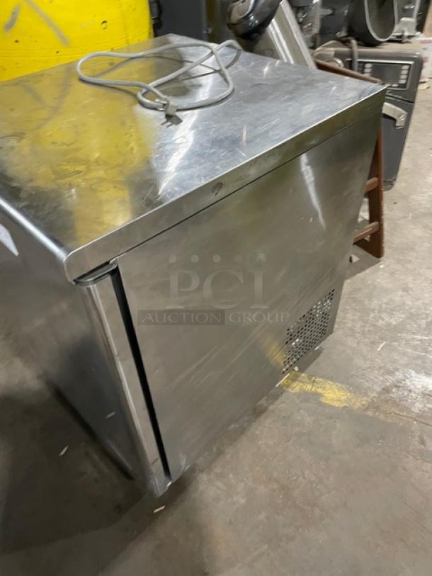 True TUF-28SD stainless steel single door undercounter freezer on casters, with poly coated rack and visible power cord.