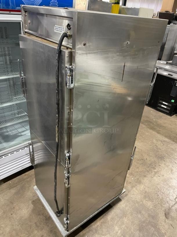 Henny Penny HC900 stainless steel heated holding cabinet, electric, half door, pan slides, on casters, used condition.