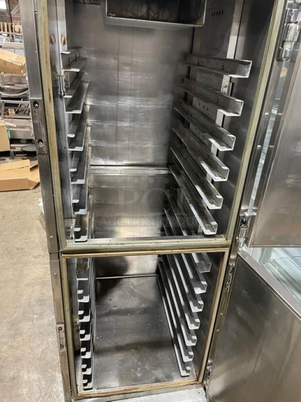 Henny Penny HC900 stainless steel heated holding cabinet with built-in pan slides, half doors, on casters; 120V, single phase.