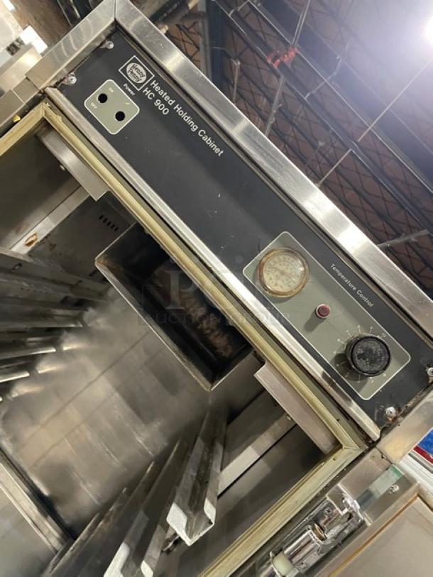 Henny Penny HC900 heated holding cabinet with half door, stainless steel, insulated, with built-in pan slides and casters.