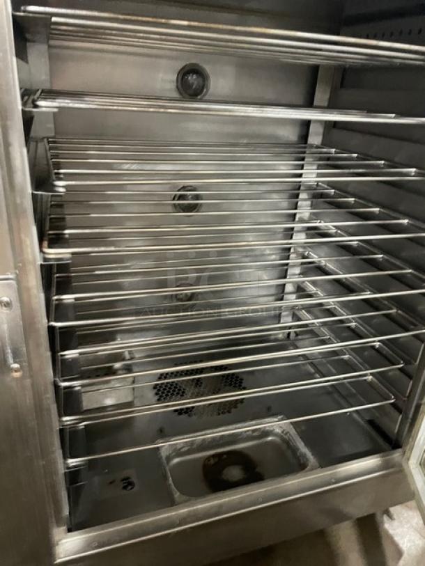 Nu-Vu SUB123 stainless steel electric double deck oven/proofer combo with wired oven racks, on casters, 208V, model visible.