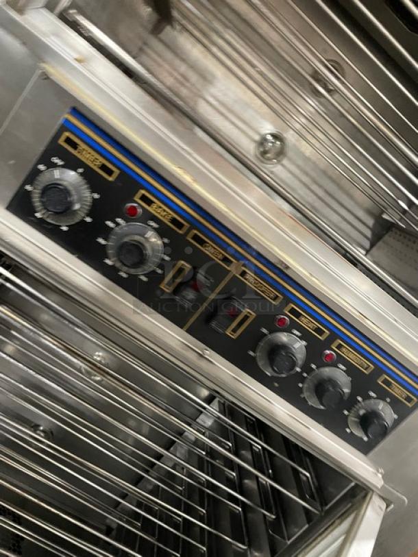 Nu-Vu SUB123 stainless steel electric double deck oven/proofer with wired oven racks, control panel detail, 208V 3+N phase, on casters.