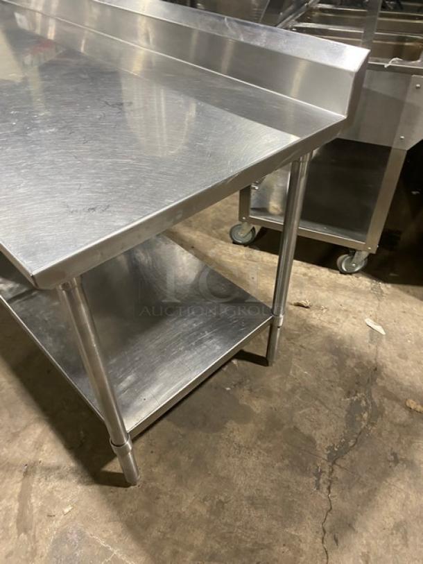 Custom stainless steel worktop table with undershelf, fitted with Alto-Shaam 500-2DN warming drawer, 120V, on legs.