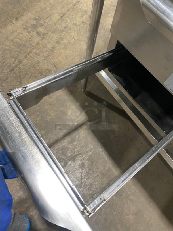 Alto-Shaam 500-2DN stainless steel worktop table with undershelf, featuring electric warming drawer, model 500-2DN, on legs.
