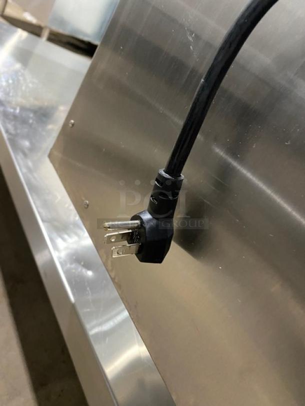 Alto-Shaam 500-2DN stainless steel worktop table with warming drawer, 120V 1 Phase, serial number 1731959-000, on legs.