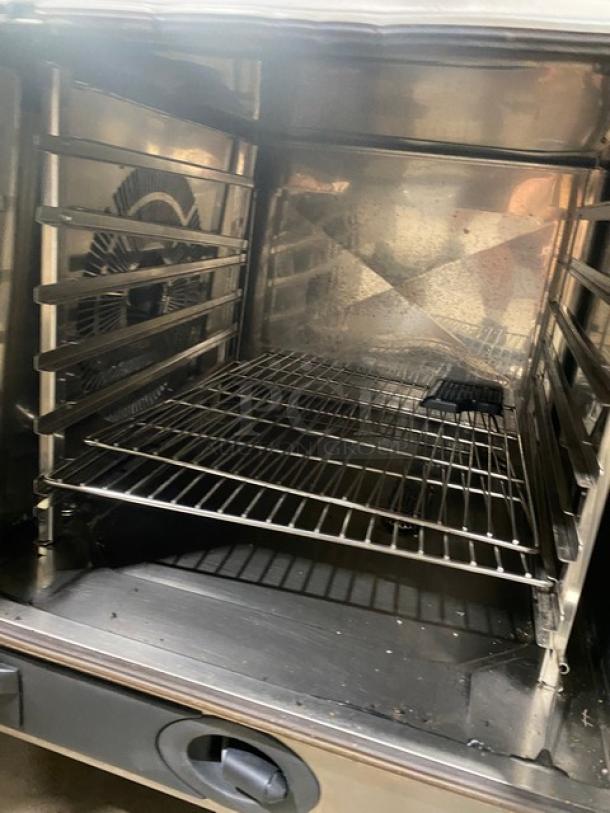 Rational SCCWE62G combi oven interior with wired racks, stainless steel, Energy Star certified, natural gas powered.