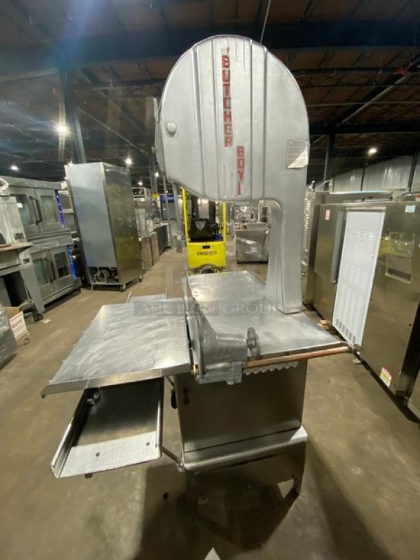 Butcher Boy commercial stainless steel electric meat band saw, free-standing, heavy-duty, on legs, in used condition.