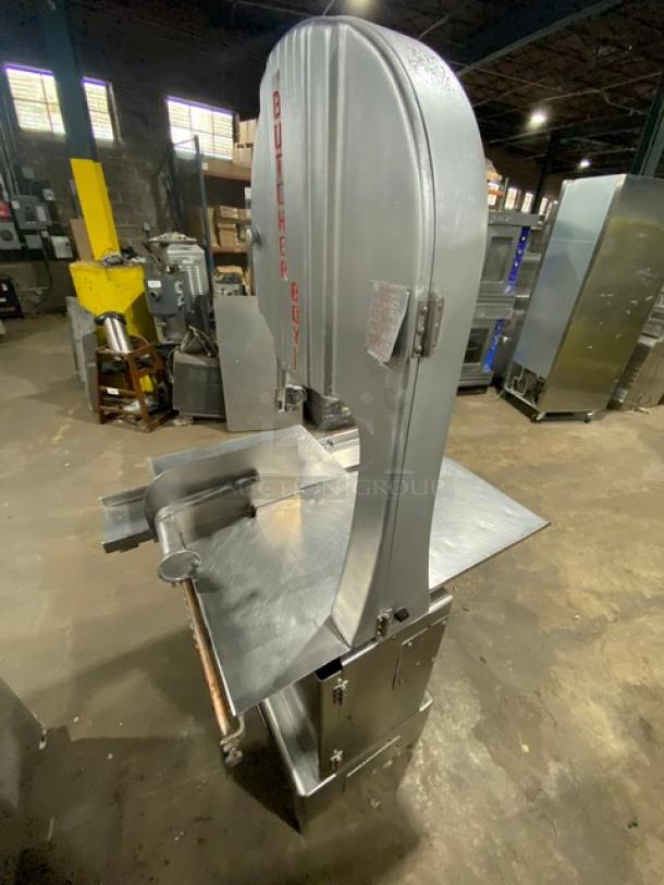Butcher Boy stainless steel electric meat band saw, heavy-duty, free-standing with legs, excellent condition, visible branding.