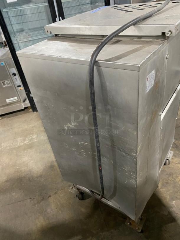 Biro commercial electric meat mixer/grinder, free-standing, heavy-duty, on casters. Visible wear, sturdy condition.