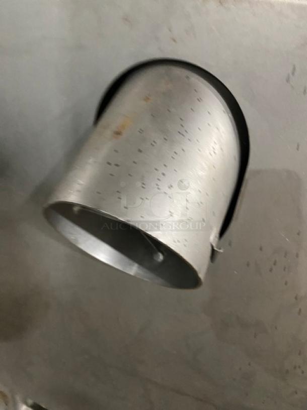 Biro commercial meat mixer/grinder attachment, gray metal, shown on a textured surface, heavy-duty industrial equipment.