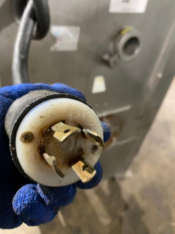 Biro commercial meat mixer/grinder plug detail, showing electrical connection on machine with visible usage wear.