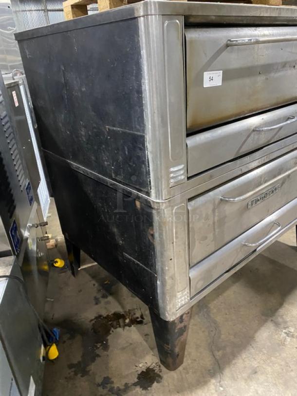 Blodgett commercial double-stacked pizza deck oven, stainless steel, natural gas, with stones, on legs, fair condition.