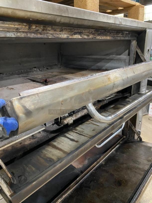 Blodgett stainless steel double-stacked pizza deck oven with stones, on legs, natural gas-powered, used condition.