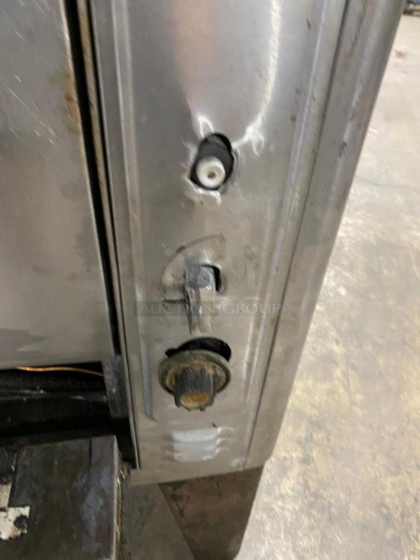 Blodgett stainless steel natural gas pizza deck oven control panel; features two knobs with signs of wear.