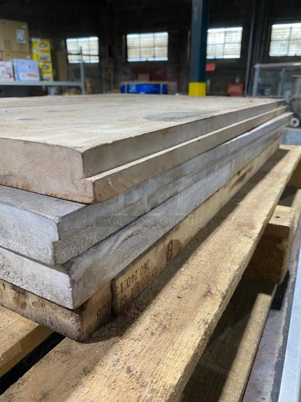 Blodgett pizza oven stones stacked on a pallet, used condition, essential for the double stacked deck oven model.