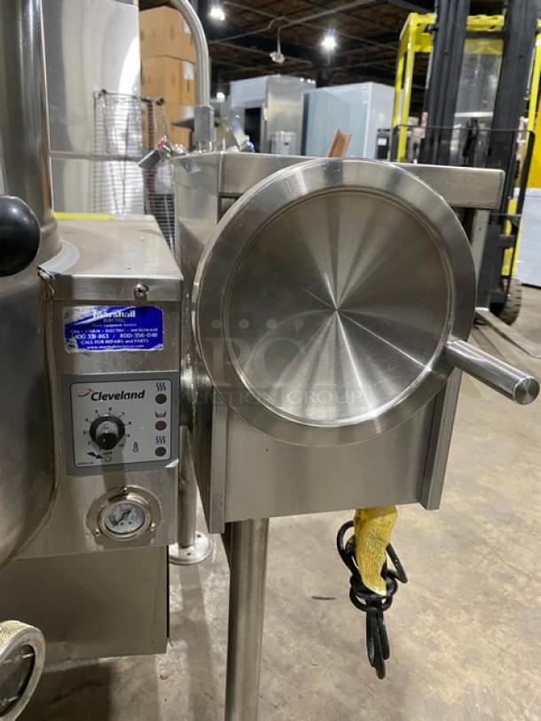 Cleveland Range KGL-40-T steam kettle, 40 gal., stainless steel, gas-powered, with swivel spout faucet, on legs, model tag visible.