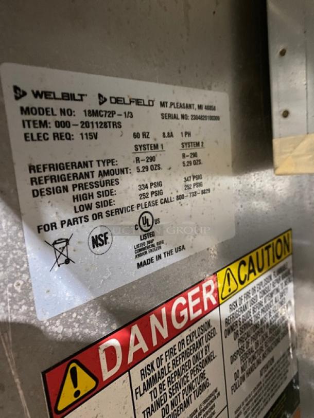 Delfield commercial stainless steel prep table label indicating Model: 18MC72P-1/3, 115V, single phase, on casters.