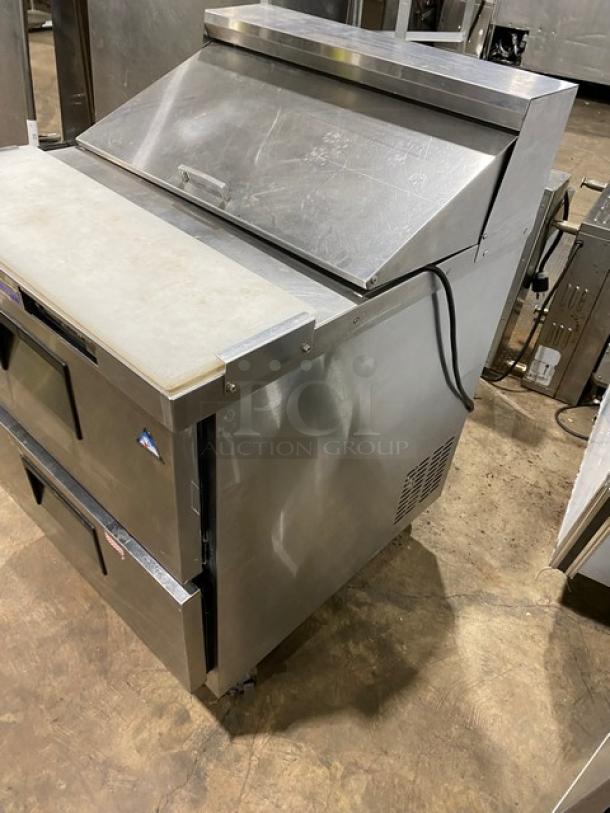 Everest EPBNR1 stainless steel refrigerated prep table with 2 drawers, cutting board, and casters. 115V, 1 phase, commercial use.