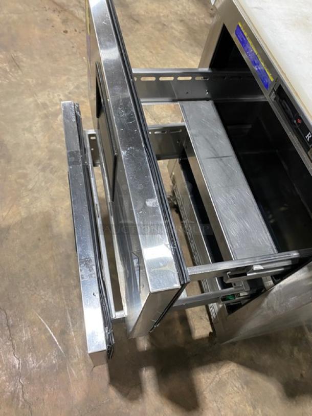Everest EPBNR1 stainless steel 2-drawer refrigerated prep table, bain marie style, with cutting board, on casters.