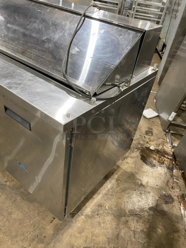 Randell 9040K-7 stainless steel 2-door refrigerated prep table with poly coated rack, on casters, 115V, model 9040K7.