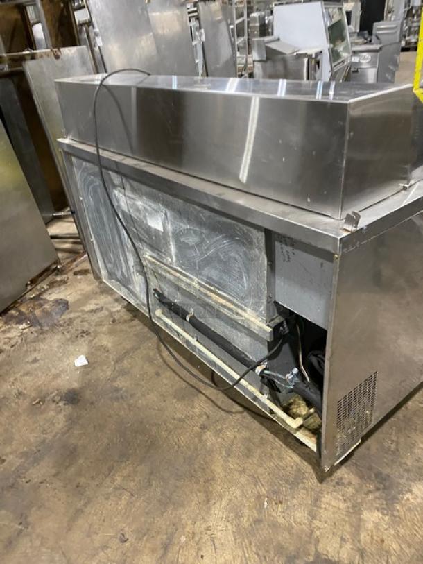 Randell 9040K7 stainless steel 2-door refrigerated prep table, bain marie style, with poly-coated rack and casters.