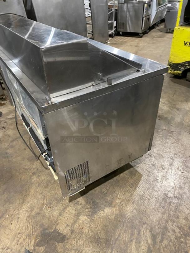Randell 9040K-7 stainless steel 2-door refrigerated prep table, Bain Marie style, poly coated wire rack, on casters.