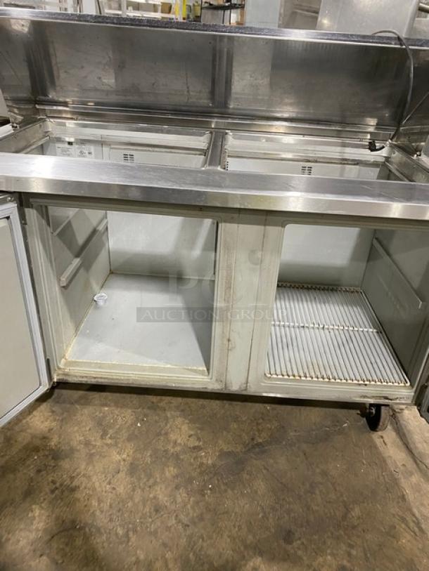 Randell 9040K7 commercial stainless steel 2-door refrigerated prep table, bain marie style, with poly coated wired rack, on casters.