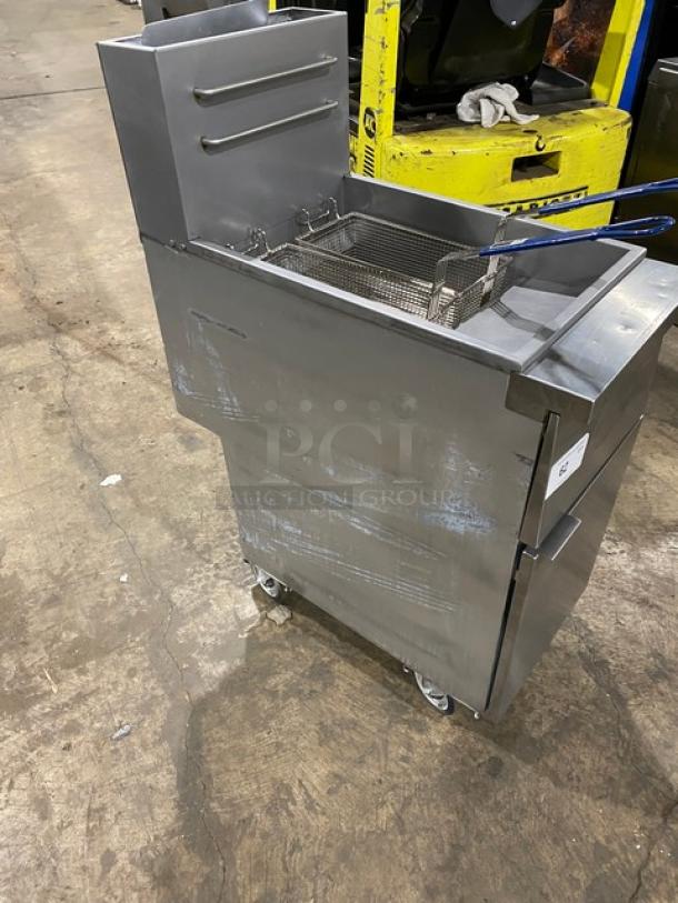 Globe GFF35G stainless steel natural gas deep fat fryer with backsplash, basket hanger, and fry baskets on casters.