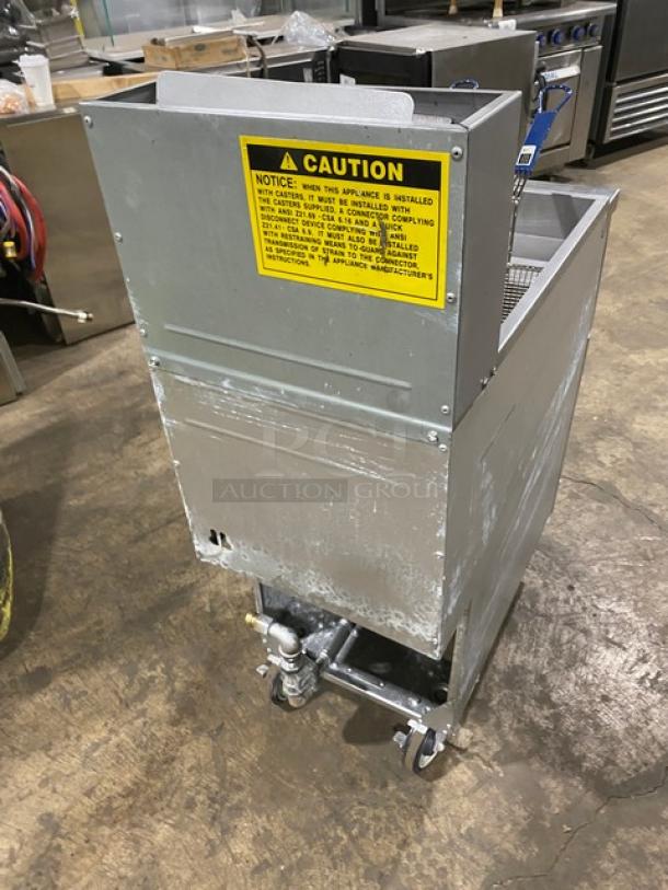 Globe GFF35G stainless steel natural gas deep fat fryer, 35-40 lb. capacity, with basket hanger, backsplash, on casters. Model: GFF35G SN: 10180137.