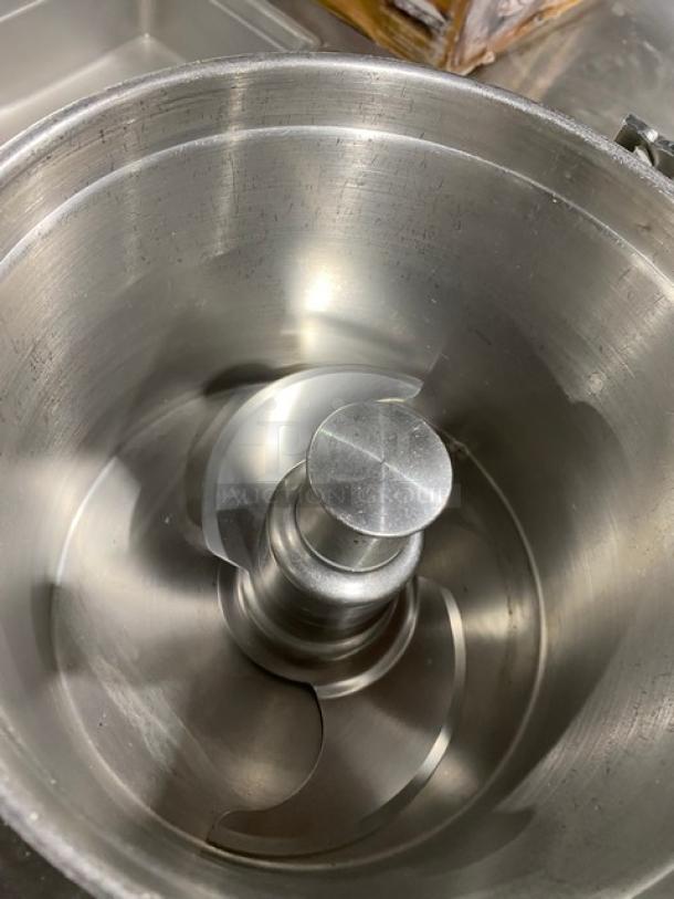 Robot Coupe R602VV food processor with 7 Qt. stainless steel bowl, electric-powered, model SN: 7240195003L-12, on legs.