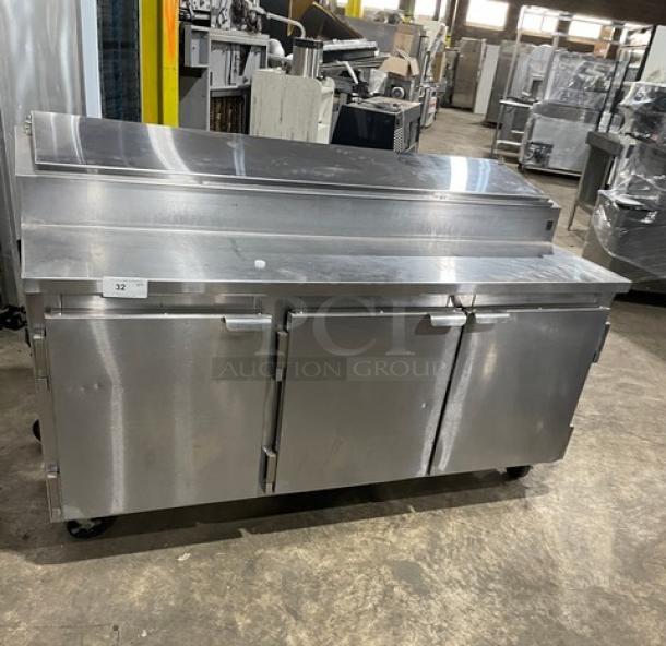 Marsal BM72R 3-door stainless steel pizza prep table, 72" wide, with pan slides, shelving, and casters. No compressor.