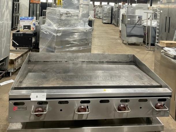 Wolf commercial stainless steel natural gas countertop flat griddle with back and side splash, on legs, used condition.
