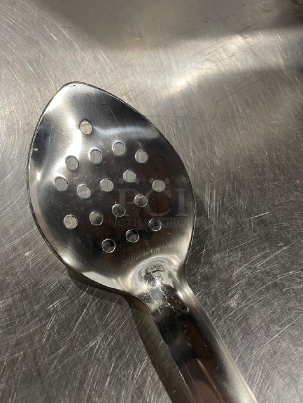 Brand new Update International 18" perforated stainless steel basting spoon, model BSPF18HD. Durable, ideal for commercial use.