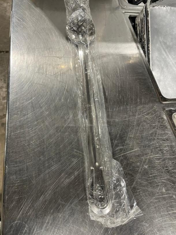 Brand new Update International 18" stainless steel perforated basting spoon, model BSPF-18HD, still in packaging.