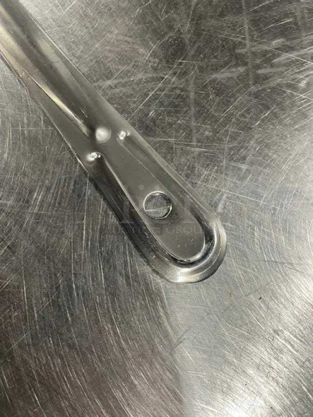 Brand new Update International 18" perforated stainless steel basting spoon, model BSPF18HD, commercial-grade.