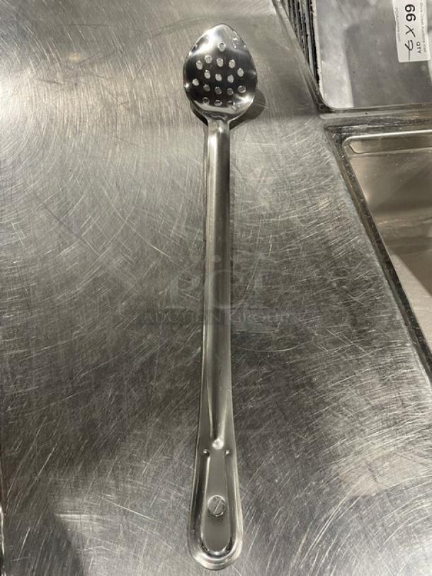Brand new Update International 18" stainless steel perforated basting spoon, model BSPF-18HD, on stainless surface.