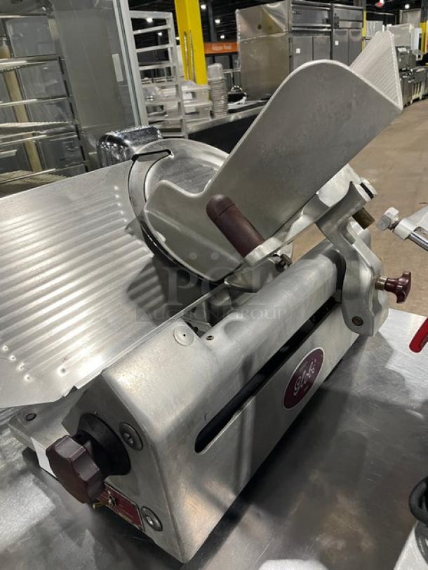 Globe Model 400 heavy-duty electric deli slicer on legs, featuring robust construction and precision slicing capability.