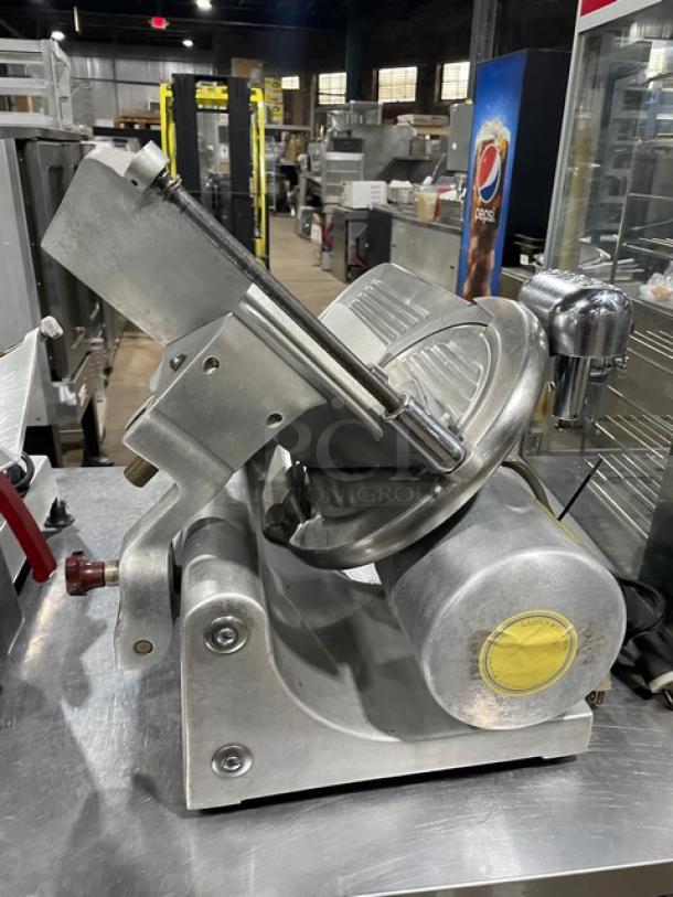 Globe Model 400 commercial electric meat slicer on legs, featuring heavy-duty metal construction and a robust blade.