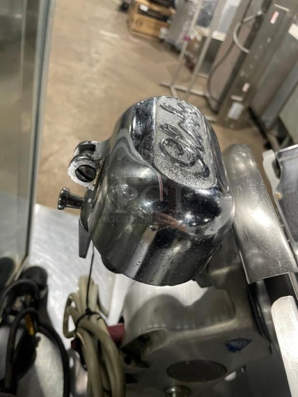 Globe Model 400 meat slicer, electric-powered, commercial-grade, countertop design with legs, visible Globe logo, sturdy condition.