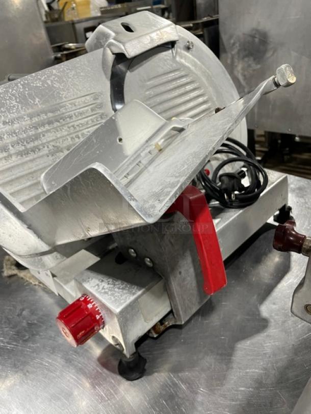 Fleetwood electric deli slicer, heavy-duty, countertop model on legs. Features blade adjustment and power cord. Used condition.
