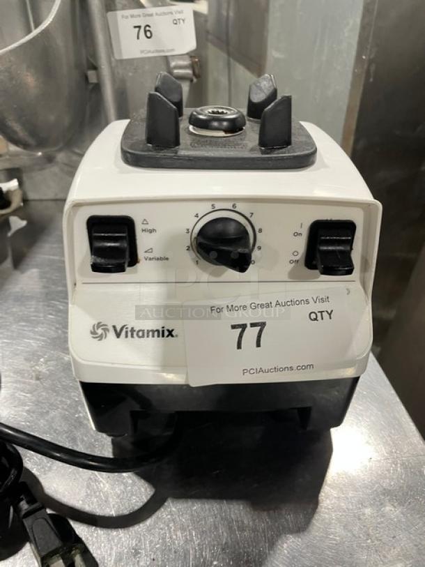 Vita-Mix VM0103 commercial food prep machine, white, 120V, on legs. Features speed dial and switches; model and serial numbers shown.