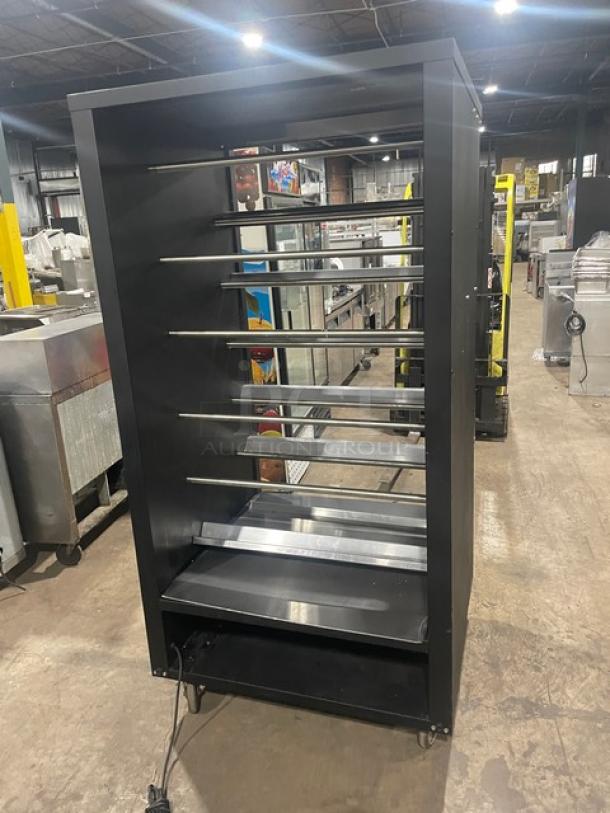 Vulcan 5-tier black donut/bagel display case with stainless steel interior, lighted shelves, enclosed storage, on casters.