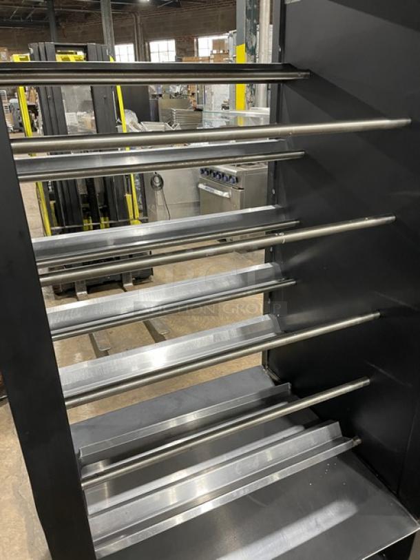 Vulcan 5-tier black bakery merchandiser with stainless steel interior, enclosed storage, on casters. Lighted display for donuts or bagels.